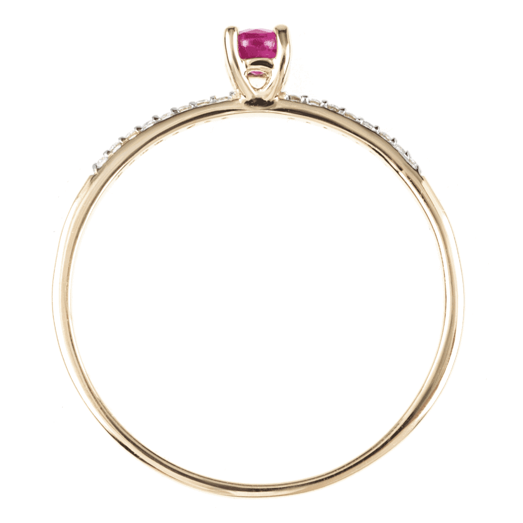 Gold ring with ruby and diamonds on white background