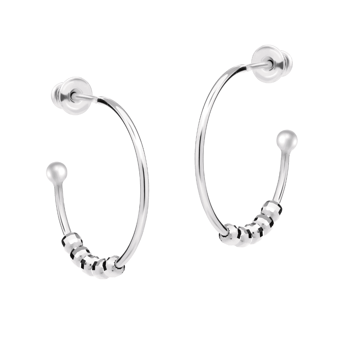 Modular hoop earrings with pendants on a bright background.
