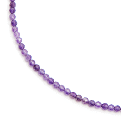 Purple necklace choker from gemstones on white background