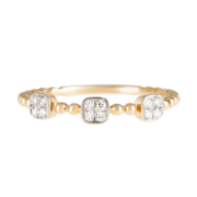 Gold ring with diamonds with three crowns on white background.