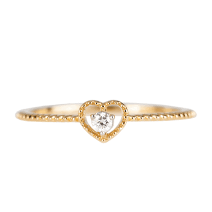 Engagement heart-shape gold ring with diamond on white background.