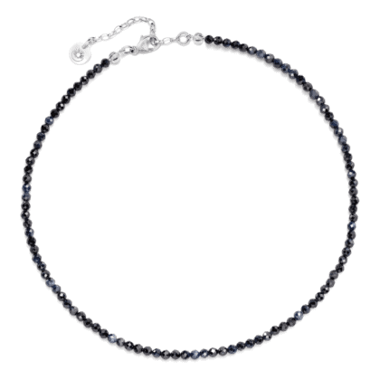Neck choker made of natural sapphire stones on a light background.