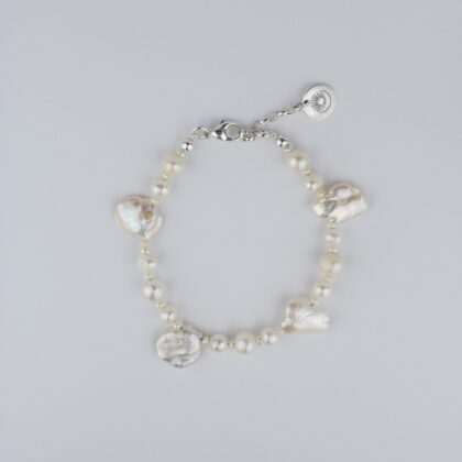 Irregular pearls bracelet  on bright background.