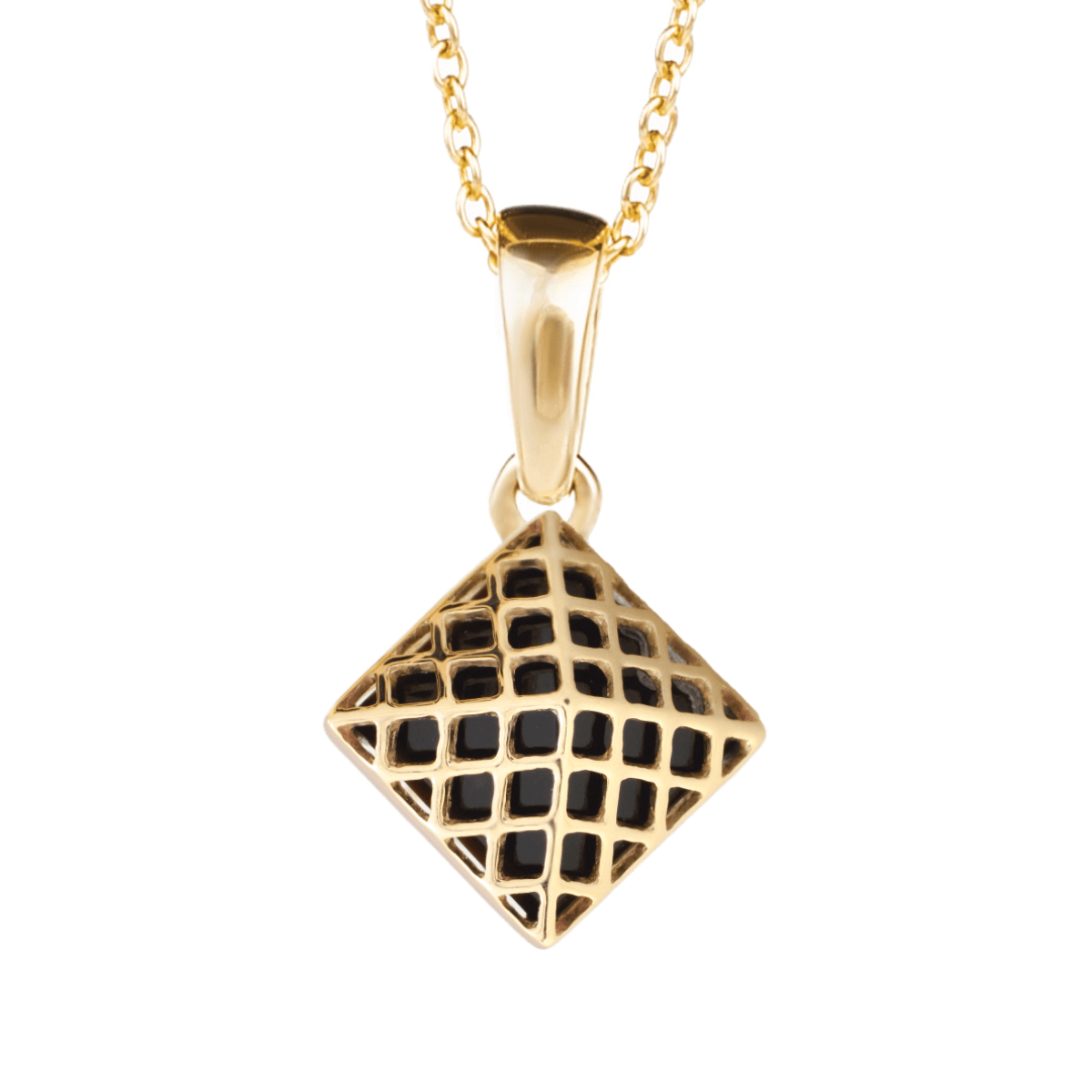 Gold pendant with onyx in the form of a pyramid on a light background.