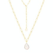 Pozłacany naszyjnik z perłą barokową na janym tle