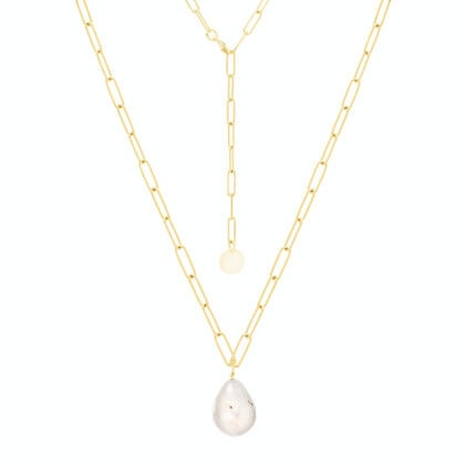 Pozłacany naszyjnik z perłą barokową na janym tle